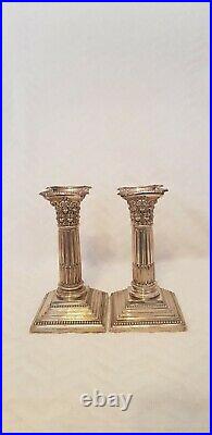 Antique Silver plated Weighted Pair Of Corinthian Column Candlesticks